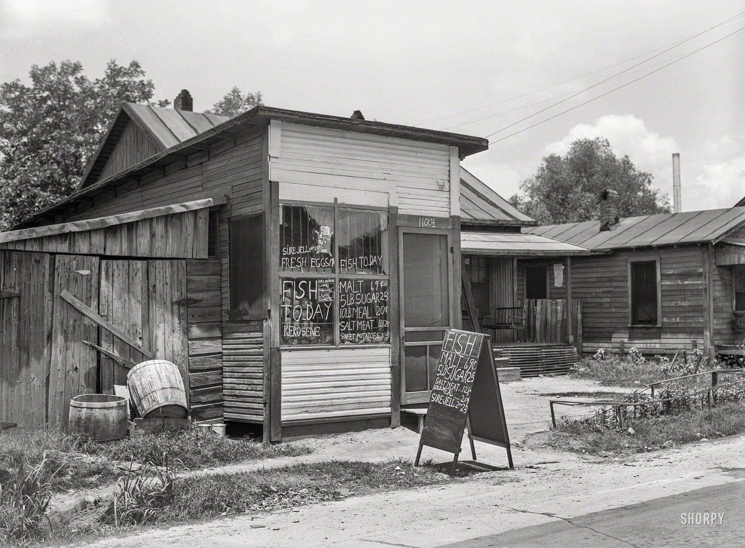 May 1939. "Negro grocery store in Laurel, Mississippi." Medium format negative by Marion Post Wolcott for the Farm Security Administration. View full size.