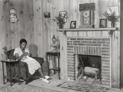 June 1939. "Daughter of Frederick Oliver, tenant purchase client, sewing in living room of new home. Summerton, South Carolina." Medium format acetate negative by Marion Post Wolcott for the Farm Security Administration. View full size.