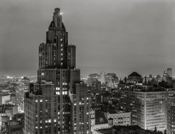 September 1939. "A rainy evening in New York City. Looking west toward the Hudson River from University Place." Medium format negative by Marion Post Wolcott. View full size.