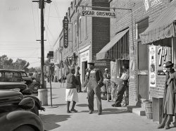 November 1939. "Main street of Wendell, North Carolina. Negroes on way to work in tobacco stem factory." Photo by Marion Post Wolcott, Farm Security Administration. View full size.