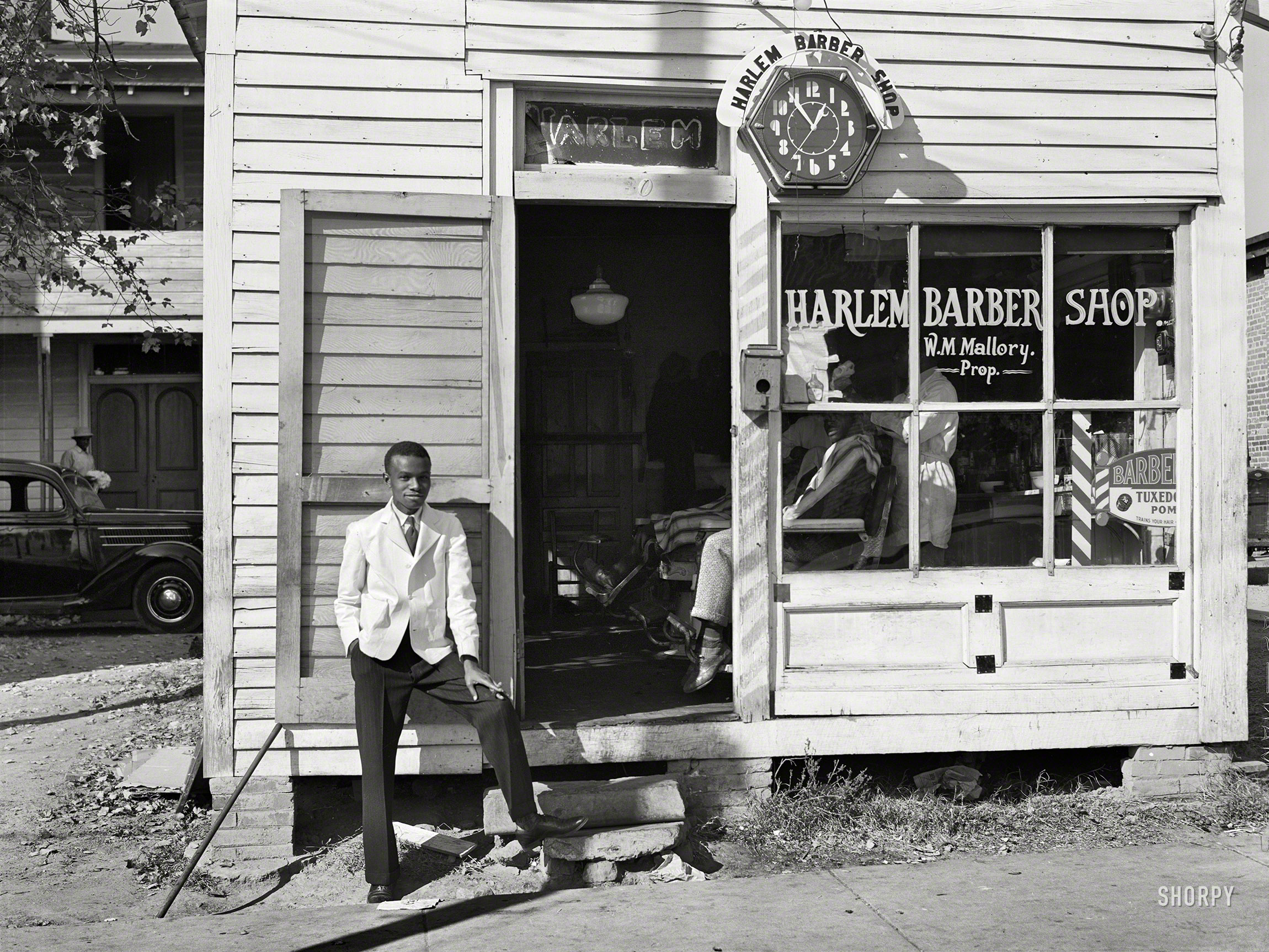 November 1939. "Barbershop on Hillsboro Street. Oxford, Granville County, North Carolina." Acetate negative by Marion Post Wolcott. View full size.