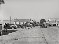 September 1939. "Street on Saturday afternoon in Belzoni, Mississippi Delta." Medium format negative by Marion Post Wolcott. View full size.