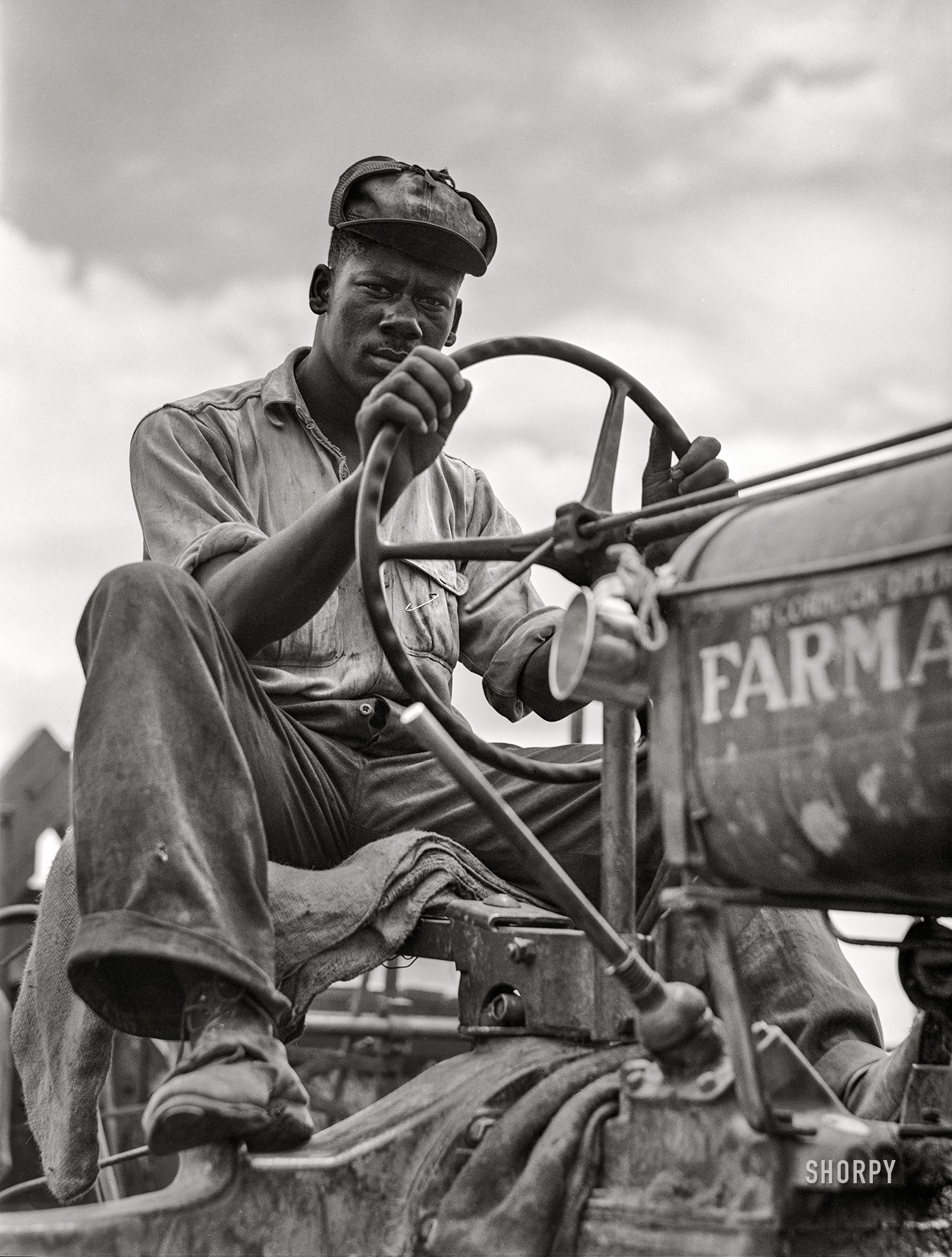 June 1940. "La Delta Project. Driver of combine threshing oats. Thomastown, Louisiana." Acetate negative by Marion Post Wolcott for the Farm Security Administration. View full size.