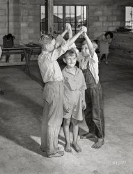 June 1940. "Supervised play hour for younger children in assembly building at Osceola migratory labor camp. Belle Glade, Florida." Medium format acetate negative by Marion Post Wolcott for the Farm Security Administration. View full size.
