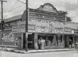 June 1940. "Natchitoches, Louisiana -- drug store." McClung Drug, "Burial place of St. Denis." Medium format acetate negative by Marion Post Wolcott. View full size.