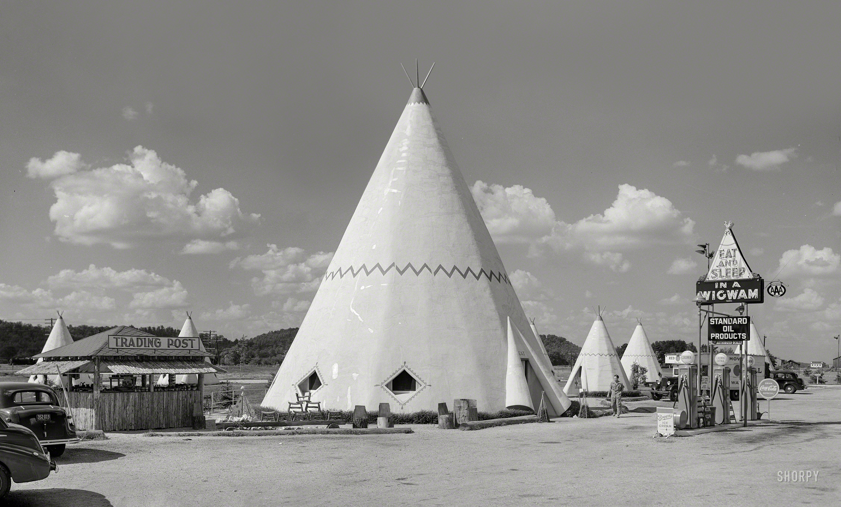 July 1940. "Cabins imitating the Indian teepee for tourists along highway south of Bardstown, Kentucky." Composite of two photos by Marion Post Wolcott. View full size.