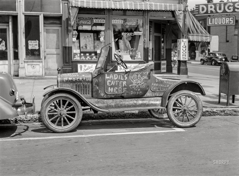 August 1940. "Car belonging to 'Hep Cats' on main street in Louisville, Kentucky." Medium format negative by Marion Post Wolcott for the Farm Security Administration. View full size.
