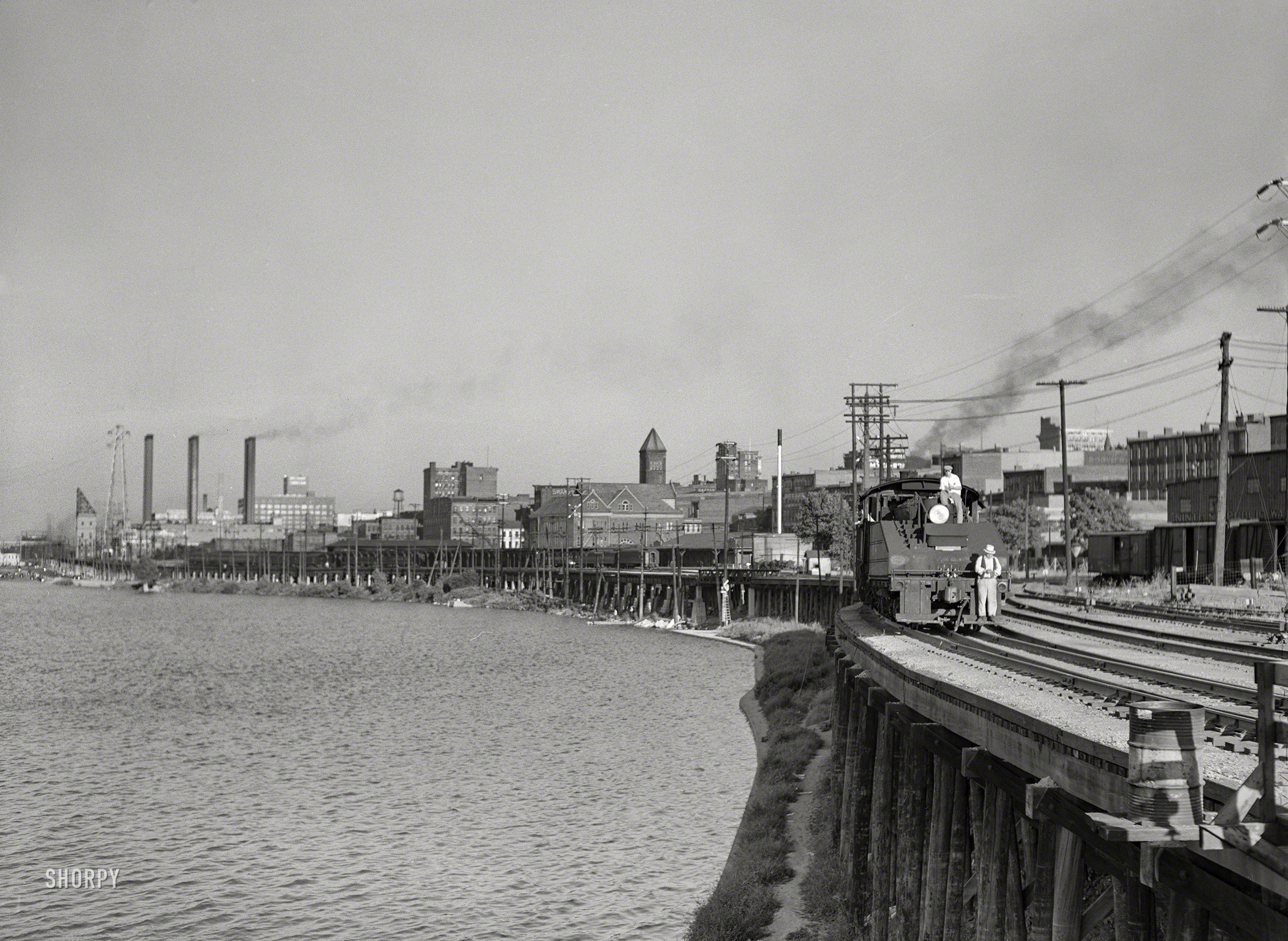 August 1940. "Kentucky. Louisville waterfront along the Ohio River." Medium format negative by Marion Post Wolcott for the Farm Security Administration. View full size.