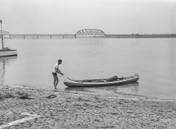 July 1940. "Canoeing on the Ohio River on Saturday. Louisville, Kentucky." Ladies and gentlemen, meet Bob. Medium format negative by Marion Post Wolcott. View full size.