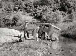September 1940. "Breathitt County, Kentucky. Car in which school superintendent and photographer went up South Fork of the Kentucky River to take pictures of conditions in rural schools." Medium format negative by the intrepid Marion Post Wolcott. View full size.