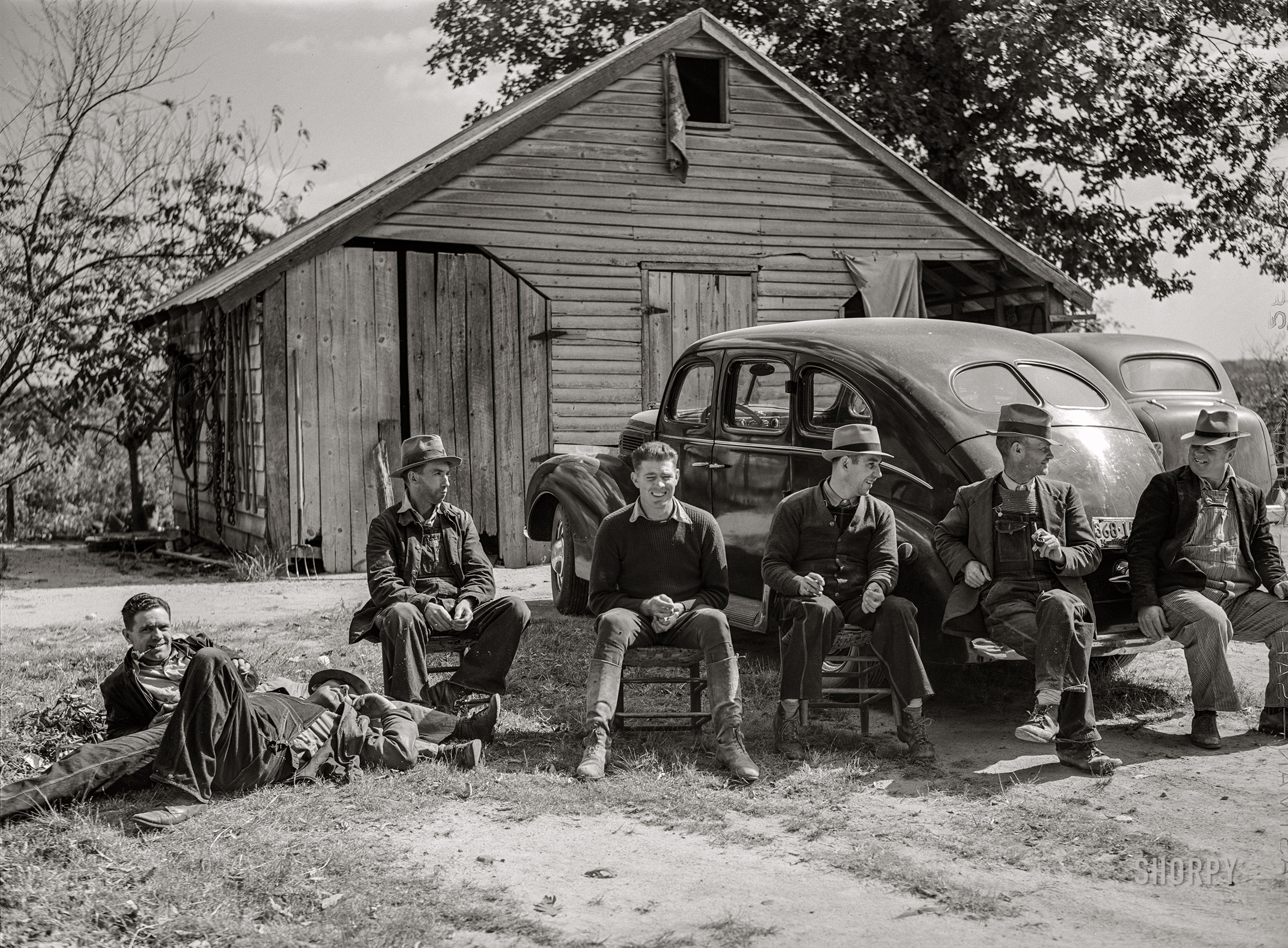 October 1940. "Resting after dinner following a corn shucking on Hooper Farm in Corbett Ridge section. Caswell County, North Carolina." Medium format acetate negative by Marion Post Wolcott for the Farm Security Administration. View full size.