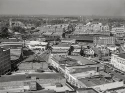 October 1940. "Durham, North Carolina. Five Points, center of city, with Chesterfield cigarette factories in background." Acetate negative by Marion Post Wolcott. View full size.