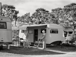 January 1941. "High class trailer camp at Sarasota, Florida. Sweeping up in front of trailer home." Medium format acetate negative by Marion Post Wolcott. View full size.