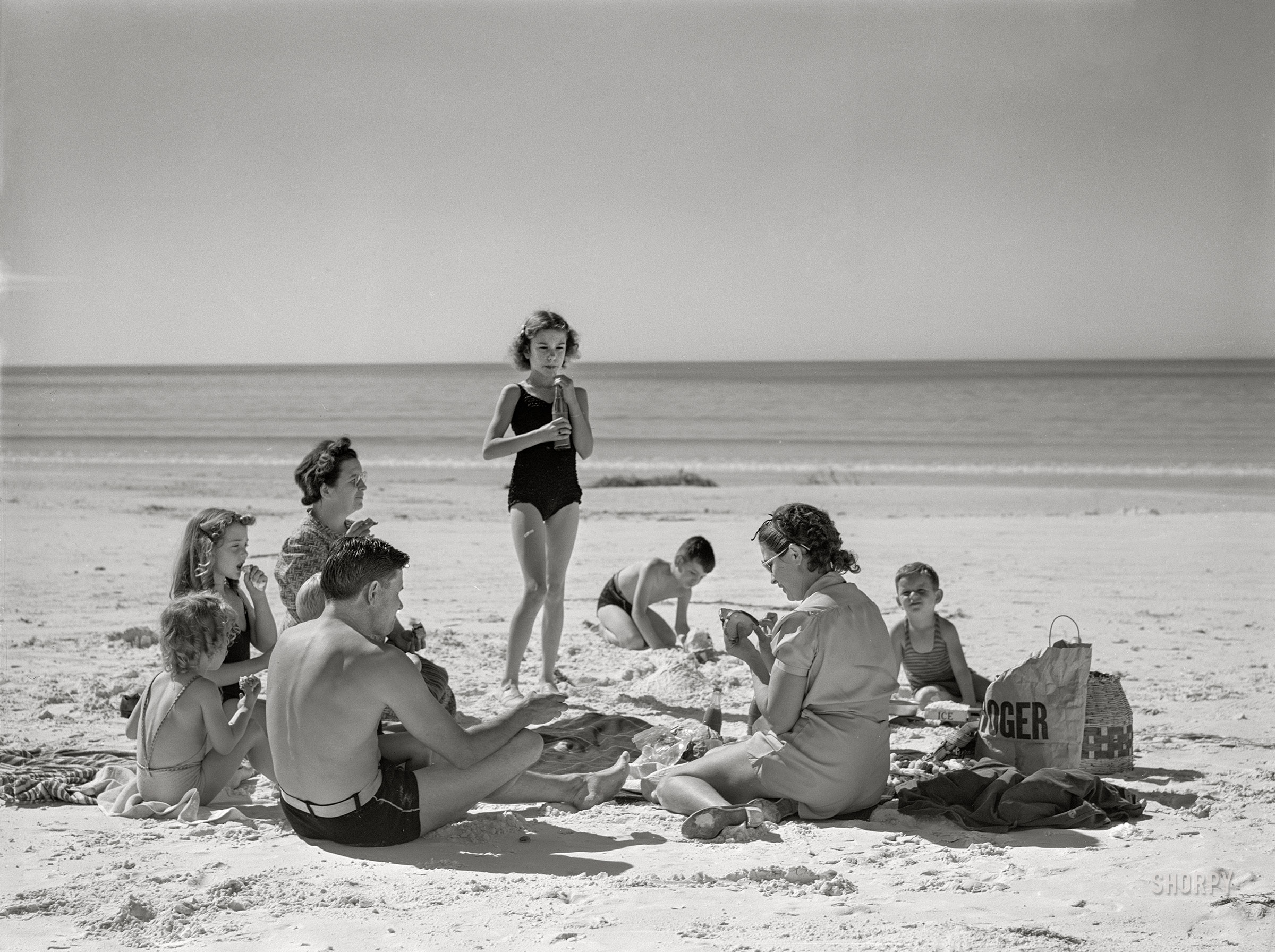 January 1941. "Guests of Sarasota trailer park picnicking at the beach." Medium format acetate negative by Marion Post Wolcott for the Farm Security Administration. View full size.