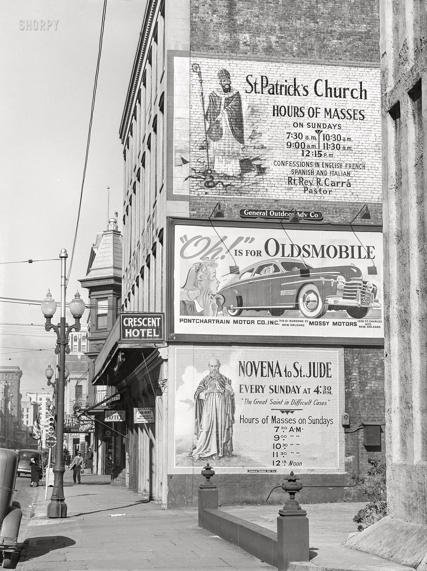 January 1941. "Billboards on side of building in New Orleans, Louisiana." Medium format acetate negative by Marion Post Wolcott for the Farm Security Administration. View full size.