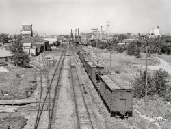 August 1941. "Rail yard and grain elevators. Minot, North Dakota," a.k.a. "The Magic City." Acetate negative by Marion Post Wolcott for the Farm Security Administration. View full size.