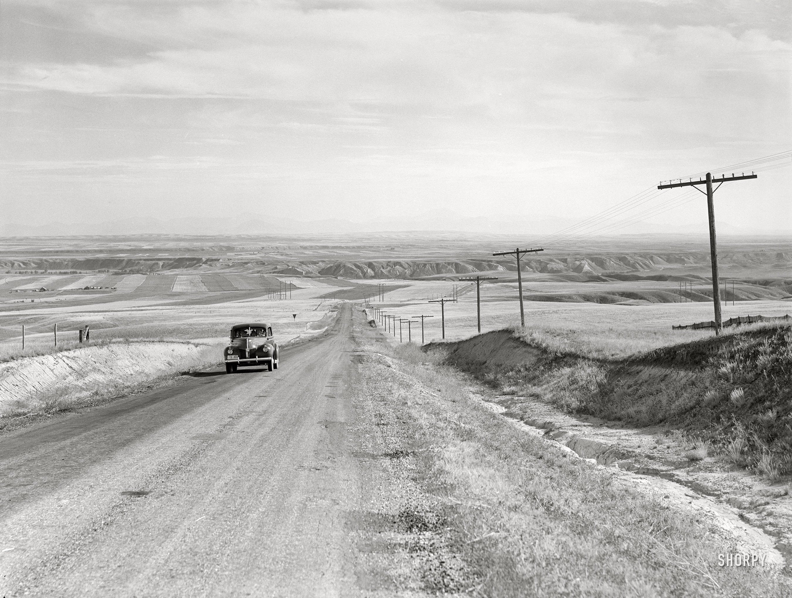 August 1941. "Highway near Havre, Montana." Medium format acetate negative by Marion Post Wolcott for the Farm Security Administration. View full size.