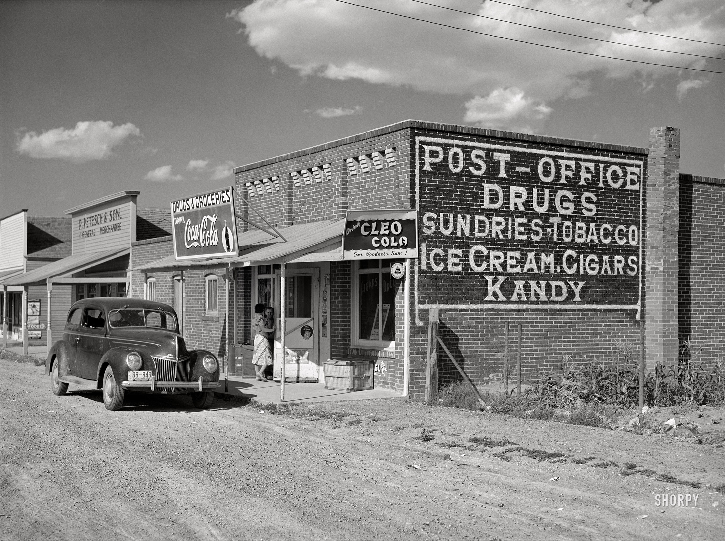 September 1941. "Buildings on main street of ghost town. Judith Basin County, Montana." Another look at the hamlet of Geyser, which seems to have an affinity for "Kandy." Acetate negative by Marion Post Wolcott for the Farm Security Administration. View full size.