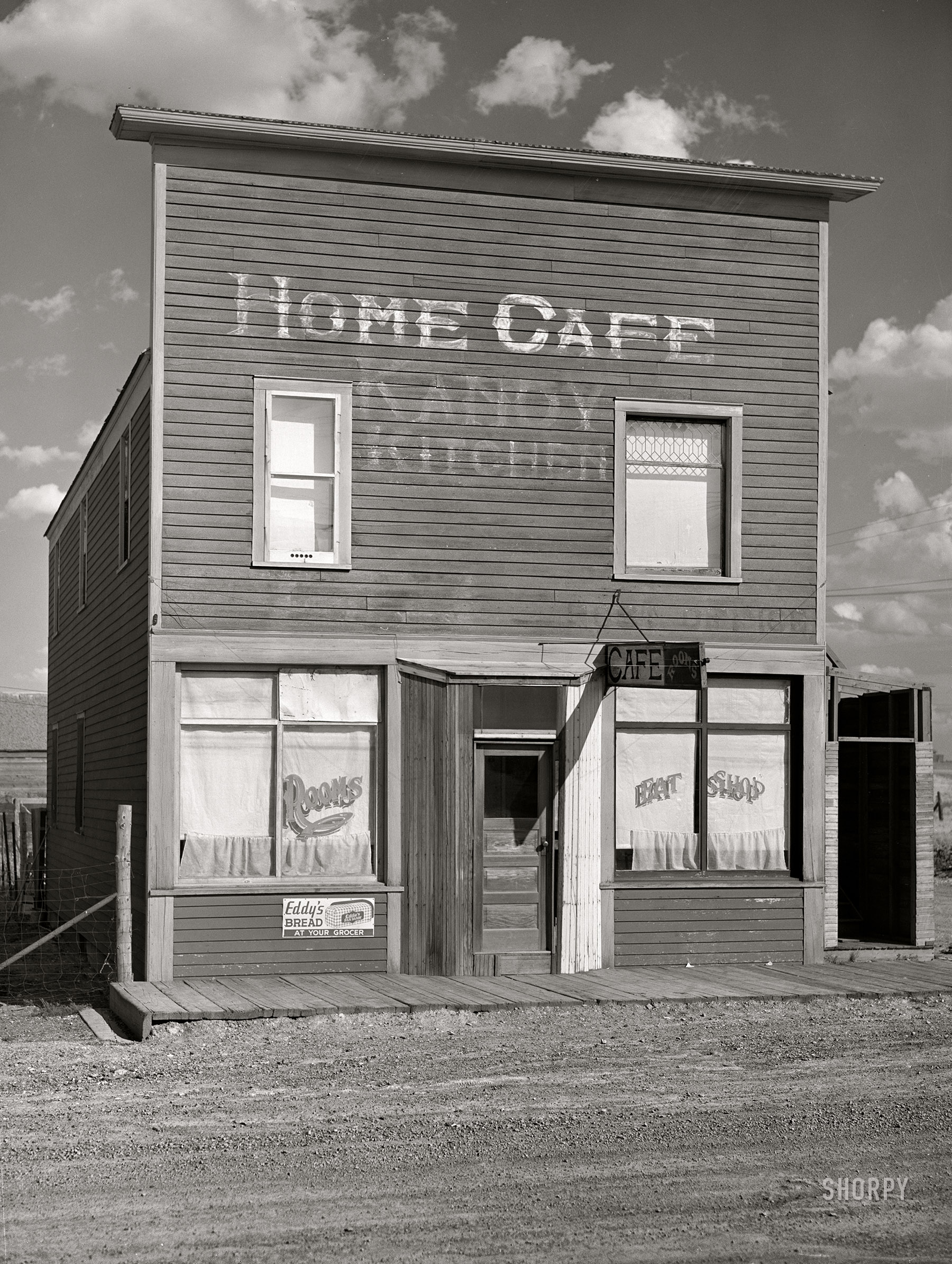 September 1941. "Building on main street of ghost town. Judith Basin County, Montana." The Home Cafe / Kandy Kitchen / Eat Shop. Also, Rooms. Medium format negative by Marion Post Wolcott for the Farm Security Administration. View full size.