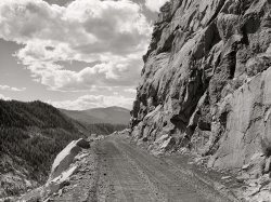 September 1941. "Road leading out of Carlton Tunnel along bed of old narrow gauge railroad on the west side of the Rocky Mountains from Leadville, Colorado." Medium format acetate negative by Marion Post Wolcott for the Farm Security Administration. View full size.