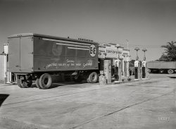 September 1941. "Transport truck in service station. Scottsbluff, Nebraska." Medium format acetate negative by Marion Post Wolcott for the Farm Security Administration. View full size.