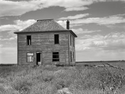 September 1941. "Abandoned farmhouse in the dry land area of the Sandhills northeast of Scottsbluff, Nebraska." Acetate negative by Marion Post Wolcott. View full size.