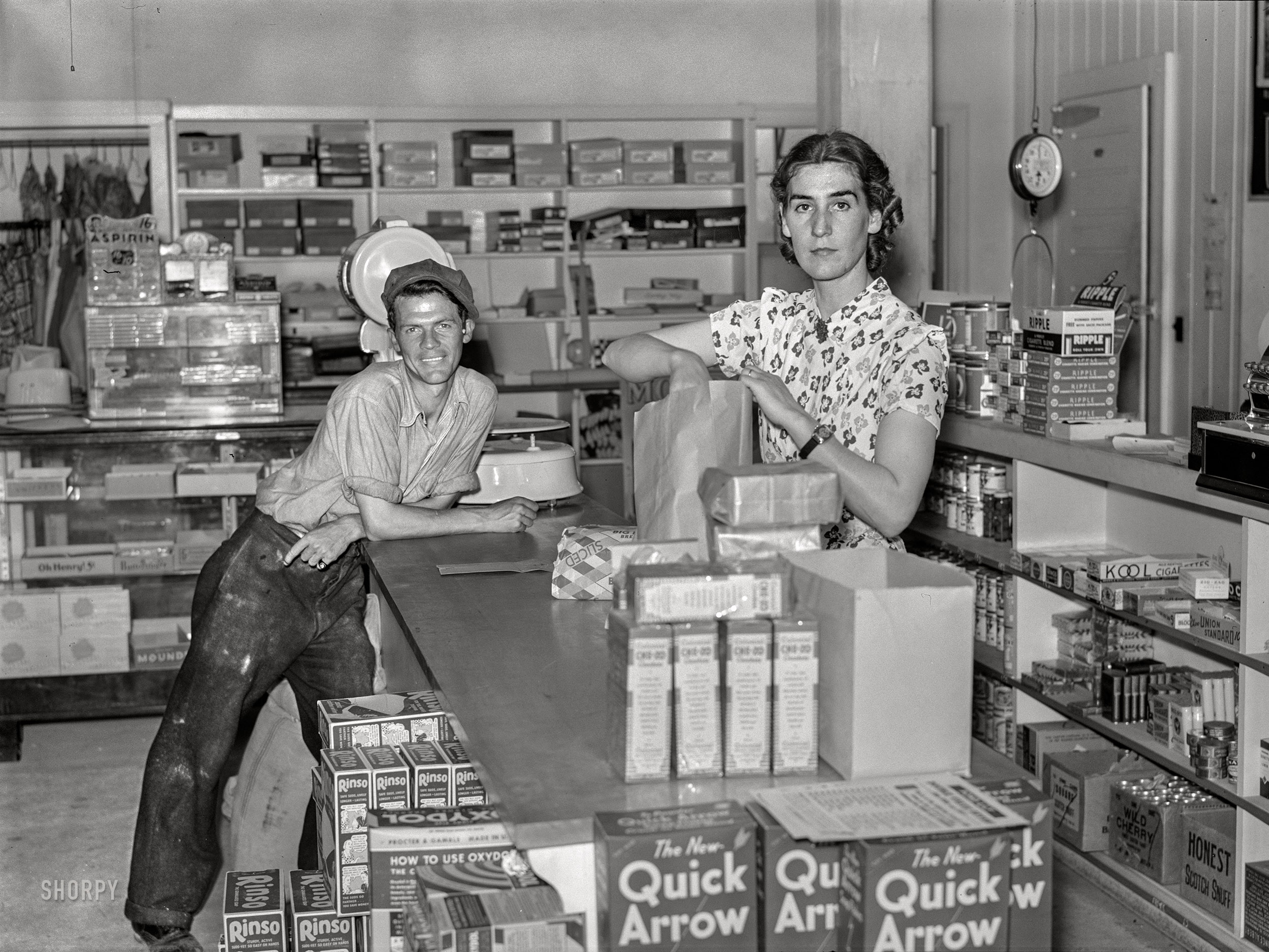 September 1938. "Buying groceries in community store. Tygart Valley, West Virginia." Medium format negative by Marion Post Wolcott for the Farm Security Administration. View full size.