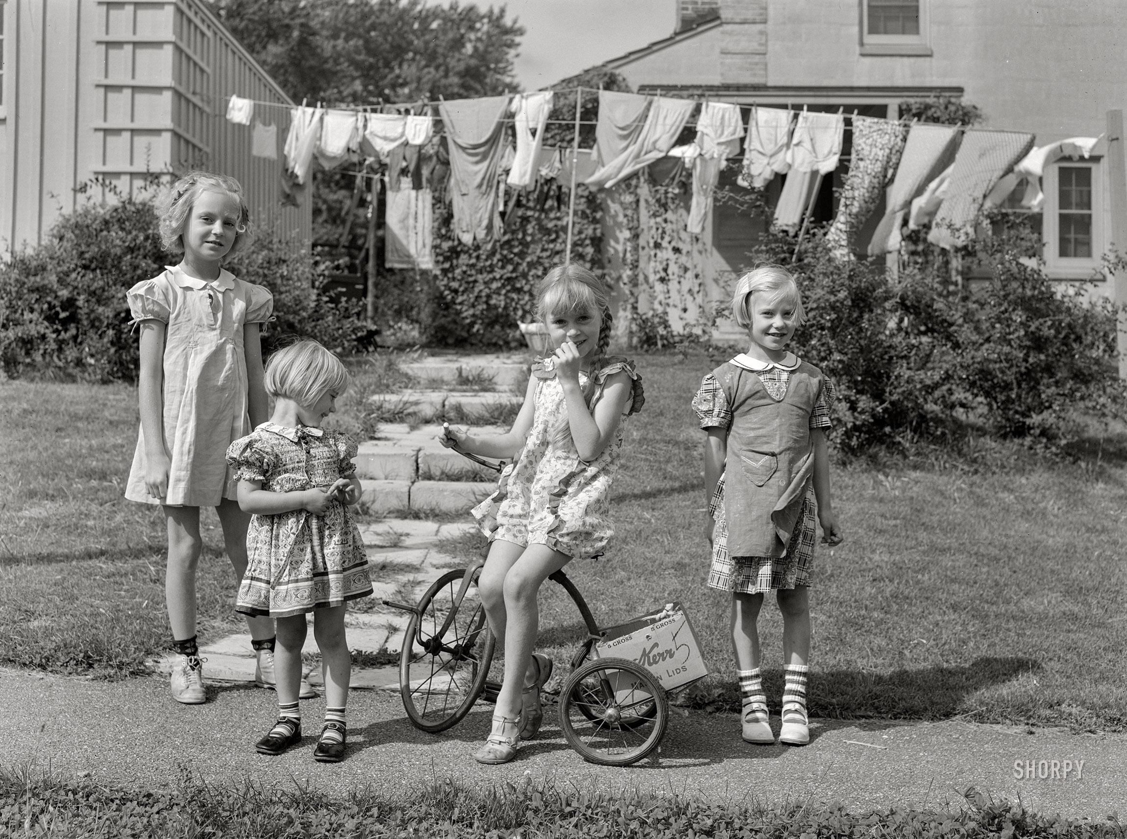 September 1939. "Children who live at Greendale, Wisconsin, a model community planned by the Suburban Division of the U.S. Resettlement Administration." Medium format acetate negative by John Vachon for the Resettlement Administration. View full size.