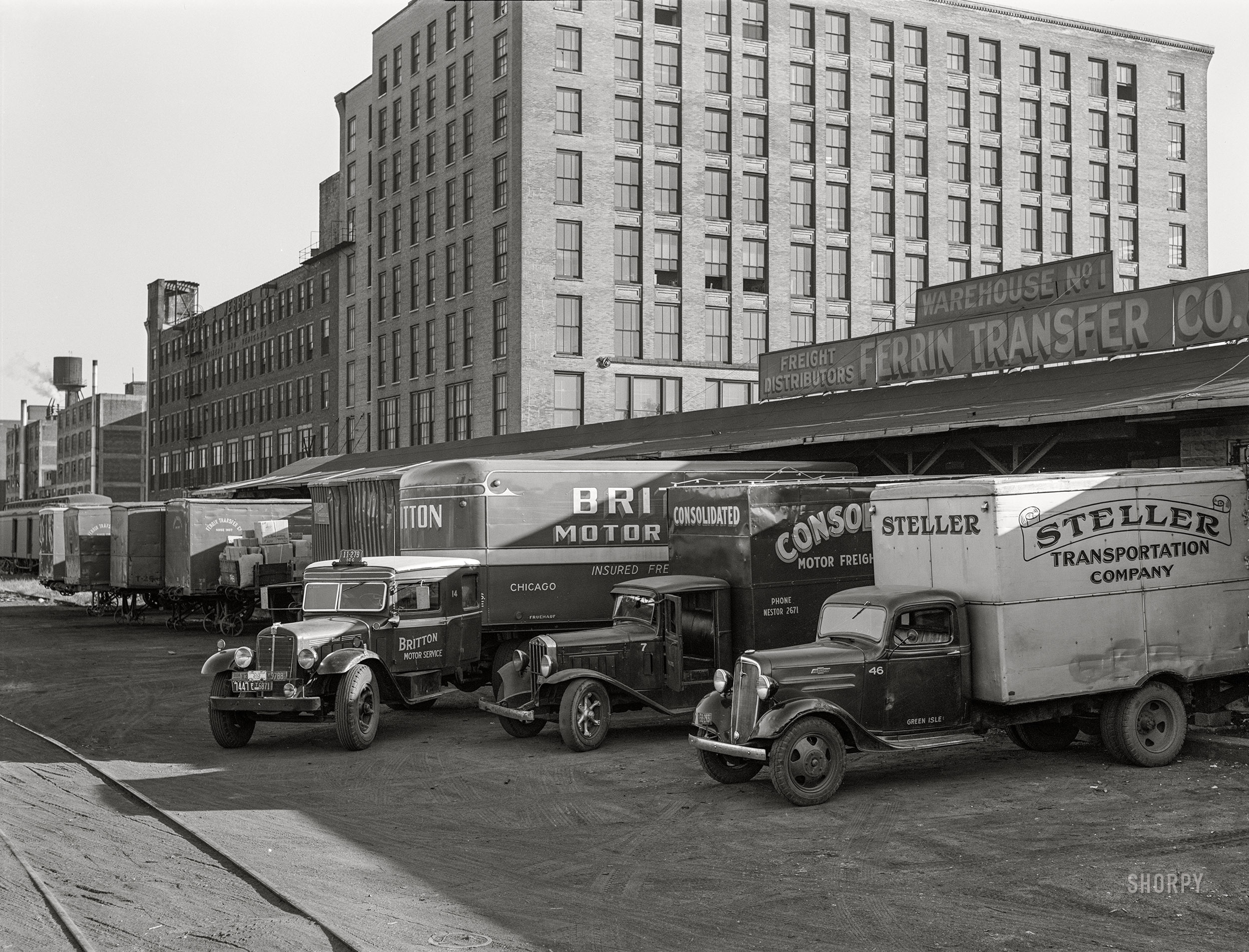 September 1939. "Trucks loading at terminal warehouse. Minneapolis, Minnesota." Medium format acetate negative by John Vachon for the Resettlement Administration. View full size.
