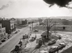 April 1940. "Gas station on a sunny afternoon. Dubuque, Iowa." Medium format acetate negative by John Vachon for the Resettlement Administration. View full size.