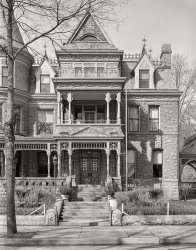 April 1940. "Victorian house. Dubuque, Iowa." Medium format acetate negative by John Vachon for the Resettlement Administration. View full size.
Redstone MansionI noticed "A A Cooper" etched into the concrete on the first step. This seems to be the Redstone Mansion in Dubuque.
We know this guy!A A Cooper is the guy whose name appears on the side of an old warehouse, last seen on Shorpy here.
It&#039;s Greystone Not RedstoneMr. Cooper built 3 houses on the same block. The one pictured is Greystone (yes, it was torn down for a parking lot in the 50s). A picture from its heyday is here:
https://www.facebook.com/ykyguidiiyr/photos/pcb.539853032776238/53985289...
The Redstone&#039;s father, the GreystoneThe Redstone wasn't quite a match. Turns out that this photo is of the Greystone, AA Cooper's grand residence in Dubuque. It was razed in the 1950s and is now the site of a parking lot. AA Cooper built the Redstone across the street for his daughter, and it survives as a Bed and Breakfast where you can stay. AA Cooper grew rich as a wagon manufacturer.
It&#039;s the GreystoneA little more detective work pulls up a photograph over at FindAGrave called "Practicing the art of porch sitting" showing the Cooper family on the porch of a building identified as the Greystone. The distinctive columns in the photo there match the columns on the porch here - so I think we've got a match.
Located directly across Bluff Street from the Redstone, it was - sadly - torn down in 1956 to make way for a municipal parking lot.
The other stoneThis may be AA Cooper's earlier mansion, Greystone. It was just across the street from Redstone, and built with gray stone - imaginative fella, that AA. Greystone was demolished in 1956 for a parking lot.
(The Gallery, John Vachon)