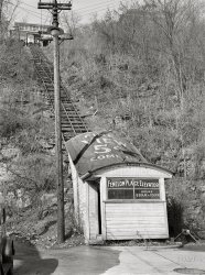 April 1940. Dubuque, Iowa. "Elevator which ascends from downtown district to residential section of bluffs." Medium format acetate negative by John Vachon. View full size.