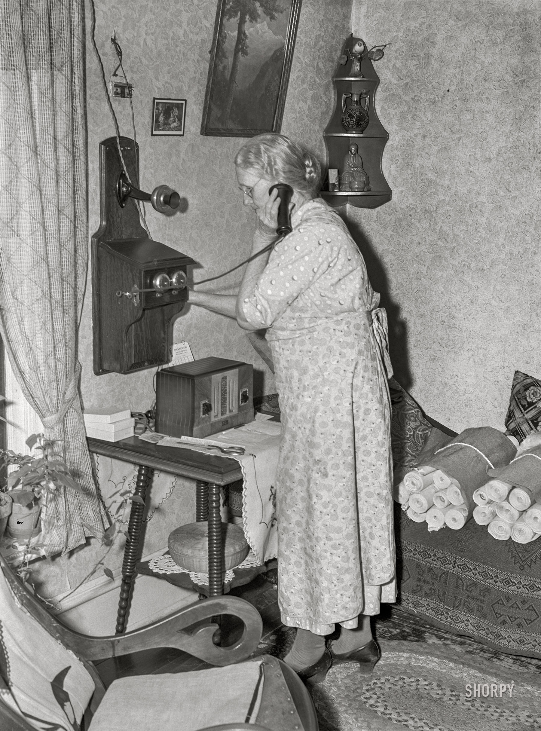 April 1940. "Lady signaling operator on old-style telephone. Scranton, Iowa." Medium format acetate negative by John Vachon for the Resettlement Administration. View full size.