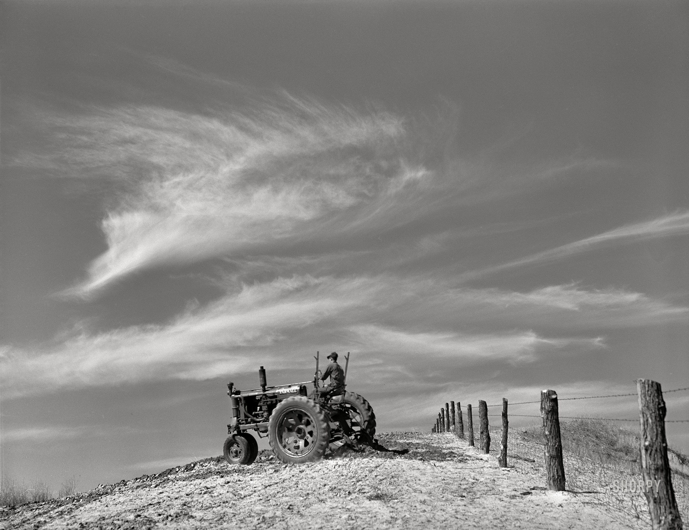 May 1940. "Planting corn using listing method. Western Iowa. Monona County." Medium format acetate negative by John Vachon for the Resettlement Administration. View full size.