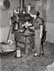 July 1940. Door County, Wisconsin. "Wife of Farm Security Administration rehabilitation borrower in her kitchen." Medium format acetate negative by John Vachon. View full size.