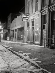 November 1940. "Pierre, South Dakota, on a cold night." Home of the Dome, luring passersby with "Beer and Dancing." Acetate negative by John Vachon. View full size.
