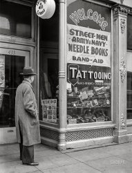 March 1941. "Tattoo parlor on West Main Street. Norfolk, Virginia." Medium format acetate negative by John Vachon for the Farm Security Administration. View full size.