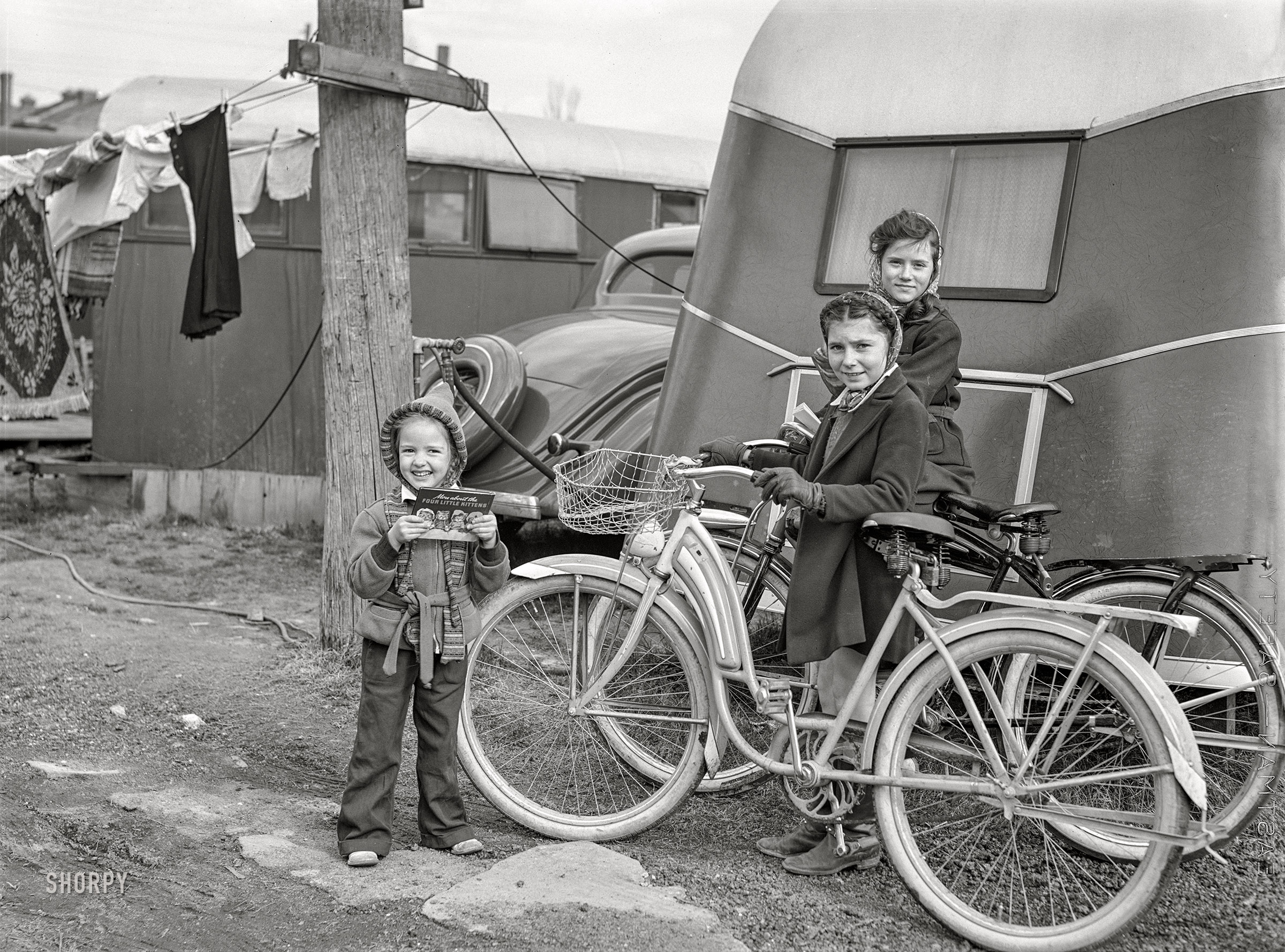 March 1941. "Girls at trailer camp for defense workers. Ocean View, Virginia, outskirts of Norfolk." Medium format acetate negative by John Vachon. View full size.