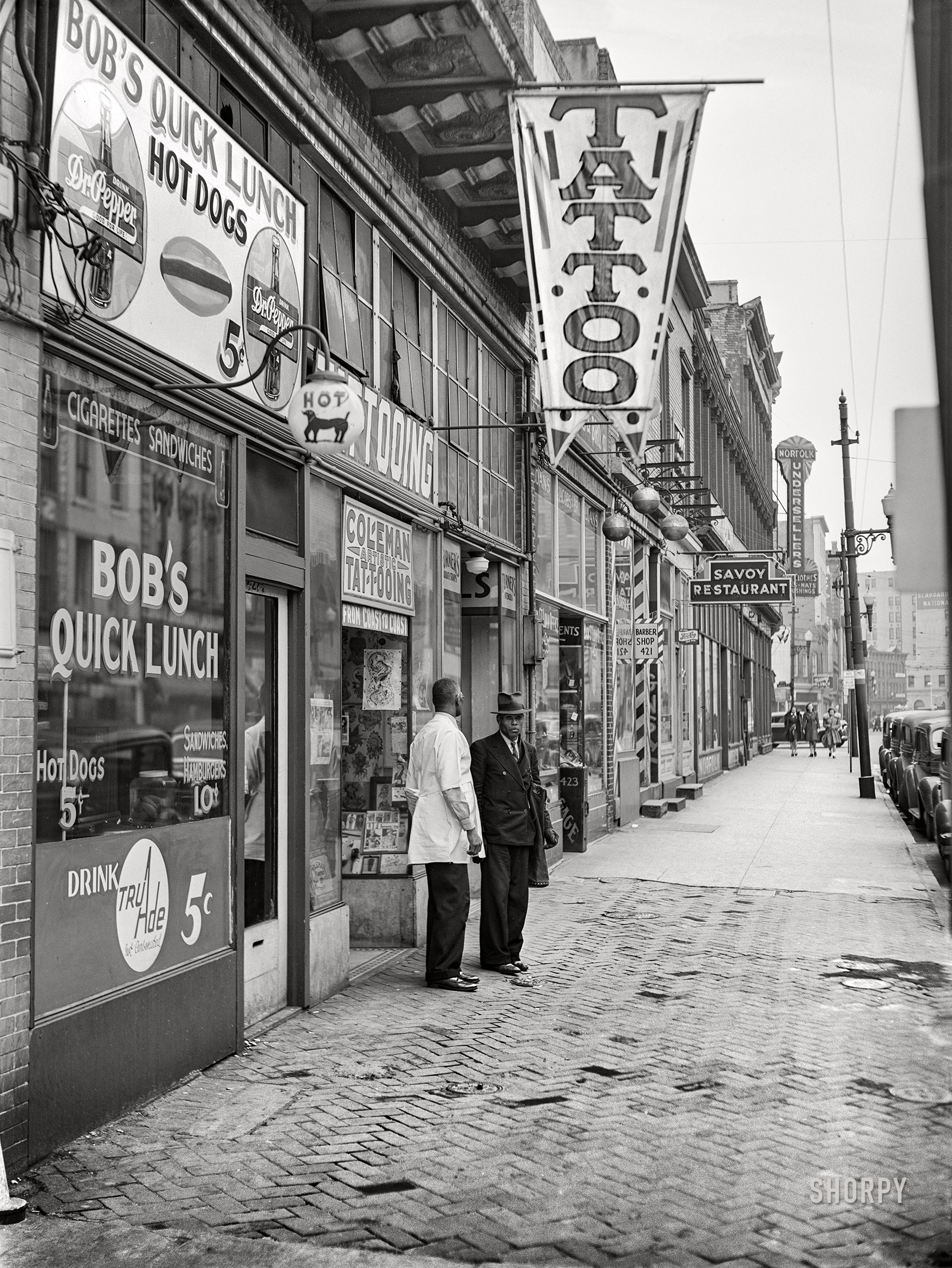 March 1941. "West Main Street. Norfolk, Virginia." Medium format acetate negative by John Vachon for the Farm Security Administration. View full size.
