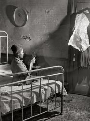 March 1941. "Bedroom. House in Negro slum district. Norfolk, Virginia." Medium format acetate negative by John Vachon for the Farm Security Administration. View full size.
There&#039;s a photo to break your heartThat poor girl.
I think if I were sleeping in that bed, I'd stuff some paper in that hole in the wall. Otherwise, I'd never sleep, watching for bugs crawling in and out.
Of course she had bigger worries than a few bugs.
I hope things got better for her.
(The Gallery, John Vachon)