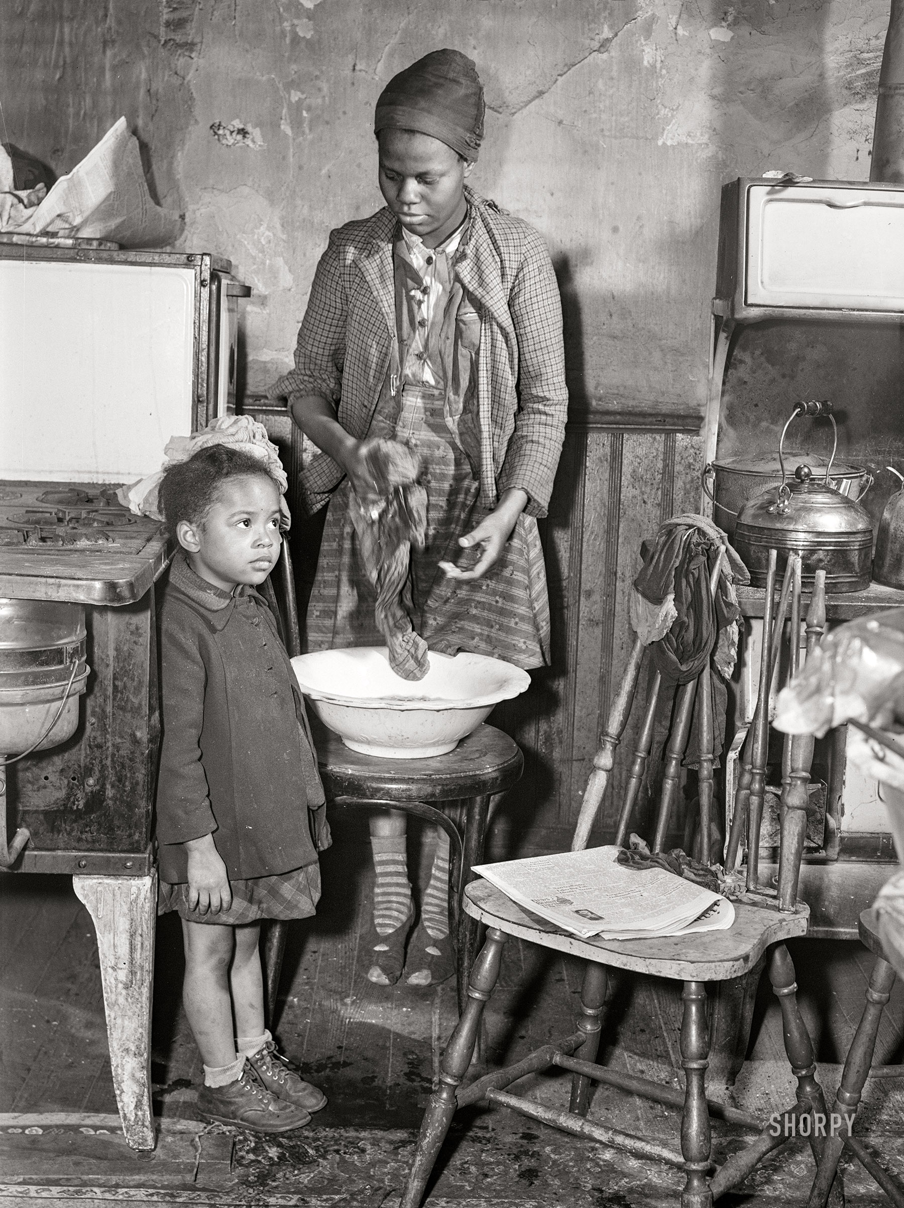 March 1941. "Daughters of defense worker. Negro slum district. Norfolk, Virginia." Medium format acetate negative by John Vachon for the Farm Security Administration. View full size.