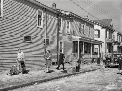 March 1941. "Portsmouth, Virginia. Houses near Navy yard." The street last seen here. Acetate negative by John Vachon for the Farm Security Administration. View full size.