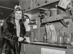 March 1941. "Sailor's wife living in trailer camp near Navy yard. Portsmouth, Virginia." Medium format acetate negative by John Vachon for the Farm Security Administration. View full size.
&quot;Some like it hot&quot;The movie came to my mind instantly.
(The Gallery, John Vachon)