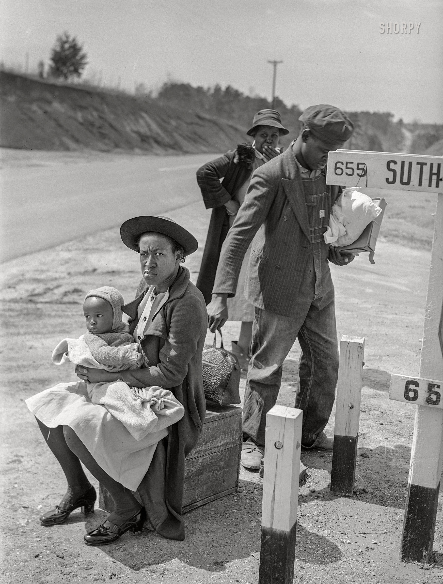 March 1941. "Negro family waiting for ride into town. Halifax County, Virginia." Medium format acetate negative by John Vachon for the Farm Security Administration. View full size.