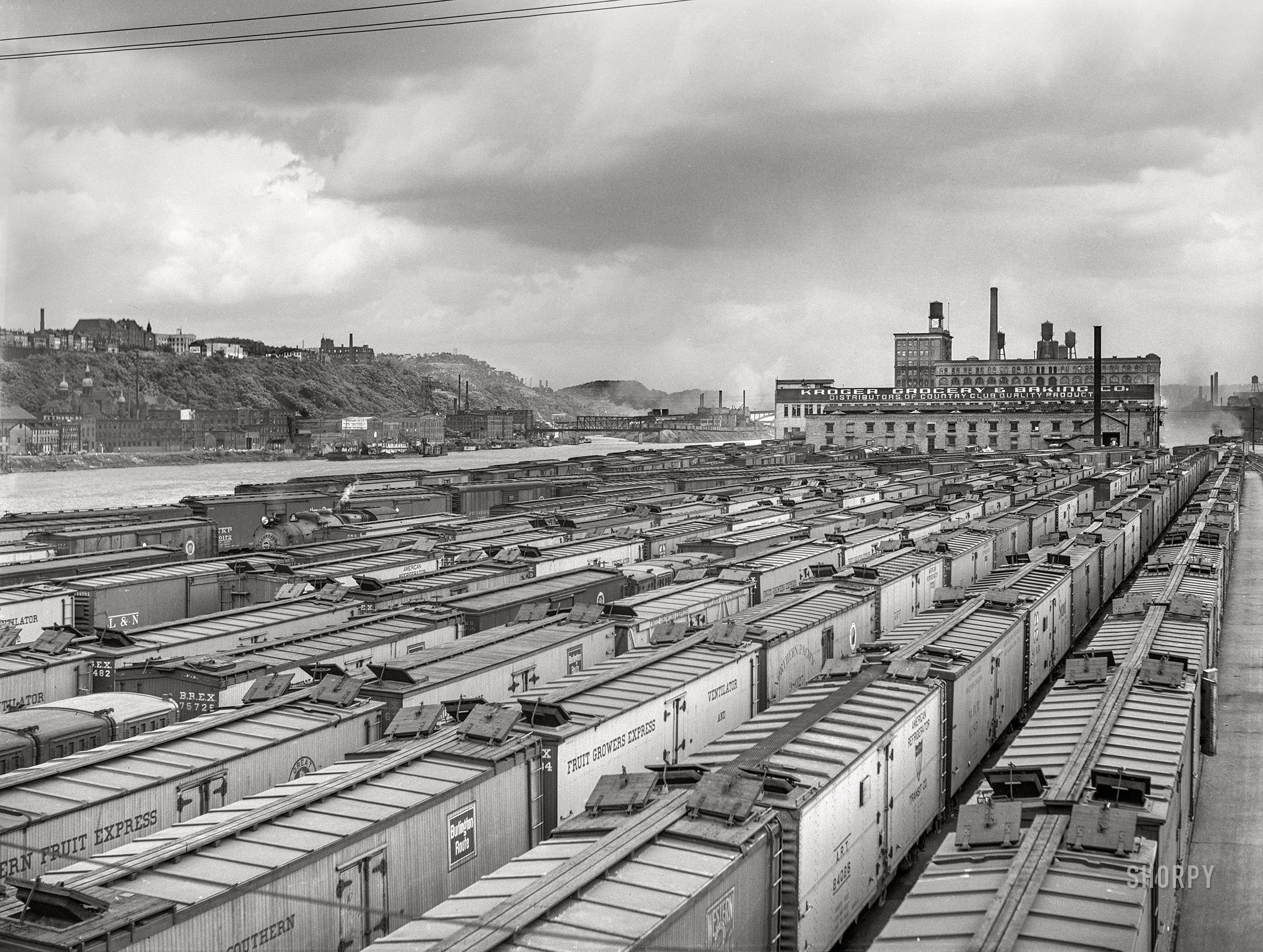 June 1941. "Carloads of fruit and vegetables at terminal. Pittsburgh, Pennsylvania." Medium format acetate negative by John Vachon for the Farm Security Administration. View full size.