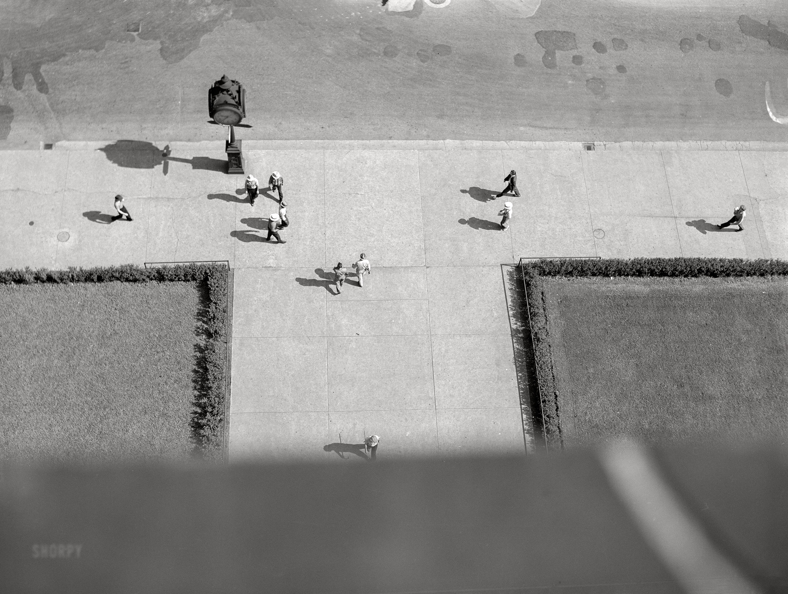 July 1941. No caption here, "here" being somewhere in Chicago at 9:37. Medium format acetate negative by John Vachon for the Farm Security Administration. View full size.