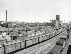 June 1941. "Railroad yards. Milwaukee, Wisconsin." Medium format acetate negative by John Vachon for the Farm Security Administration. View full size.
By Any Other NameMILW is the reporting mark of the Chicago, Milwaukee, St. Paul and Pacific Railroad as can be seen on some of the boxcars in the foreground.  It was also known as the Route of the Hiawathas, used to name a number of its high speed passenger trains as seen on a boxcar in the background.
It was the last of the transcontinental railroads to go into service and was famed for its two sections of electrified trackage in Montana, Idaho and Washington.  It all came to an end with its third bankruptcy in 1977.  Sections of the railroad still remain in use by Canadian Pacific and others.
(The Gallery, John Vachon, Milwaukee, Railroads)