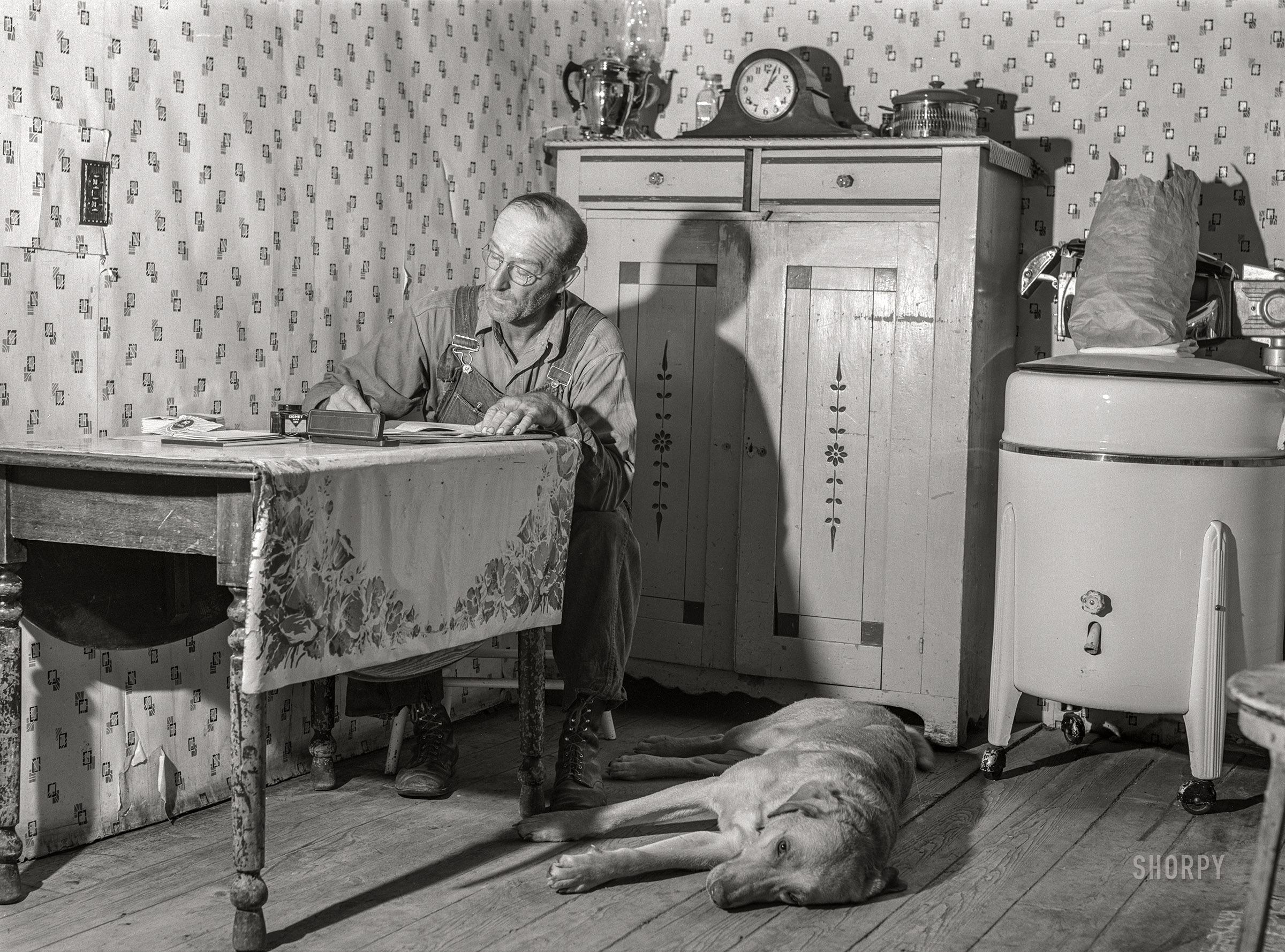 August 1941. "FSA borrower working on accounts. Itasca County, Minnesota." Medium format acetate negative by John Vachon for the Farm Security Administration. View full size.
