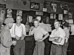 August 1941. "Farm boys in beer parlor on Sunday afternoon. Finnish community of Bruce Crossing, Michigan." Photo by John Vachon for the Farm Security Administration. View full size.