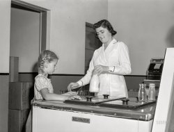 August 1941. "Child buying bottle of milk. Duluth Milk Company. Duluth, Minnesota." Medium format acetate negative by John Vachon for the Farm Security Administration. View full size.